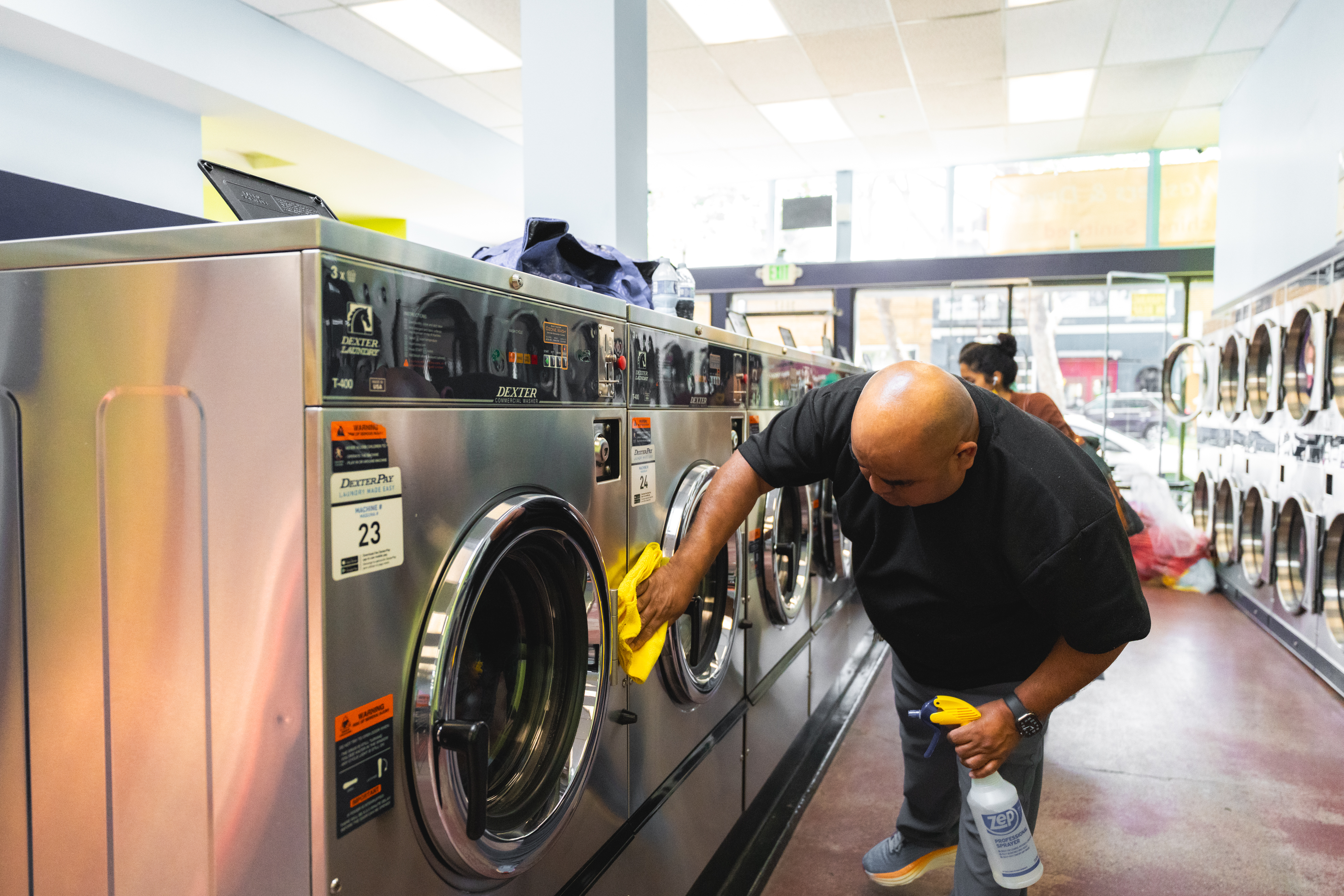 Staff Wiping Washer With Zep Spray 1
